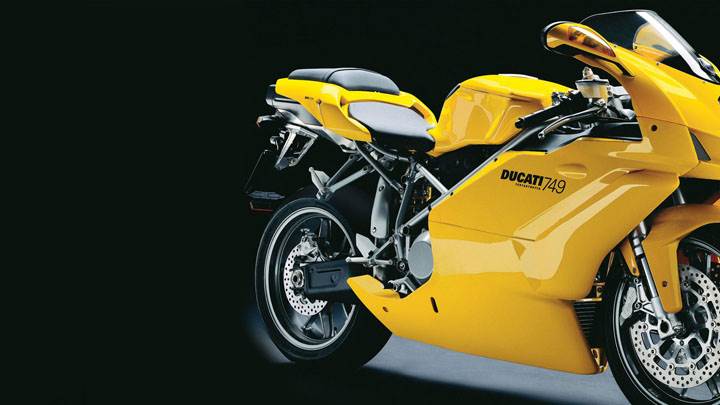 Ducati 749 2005 in Yellow Side Pose And Black Background